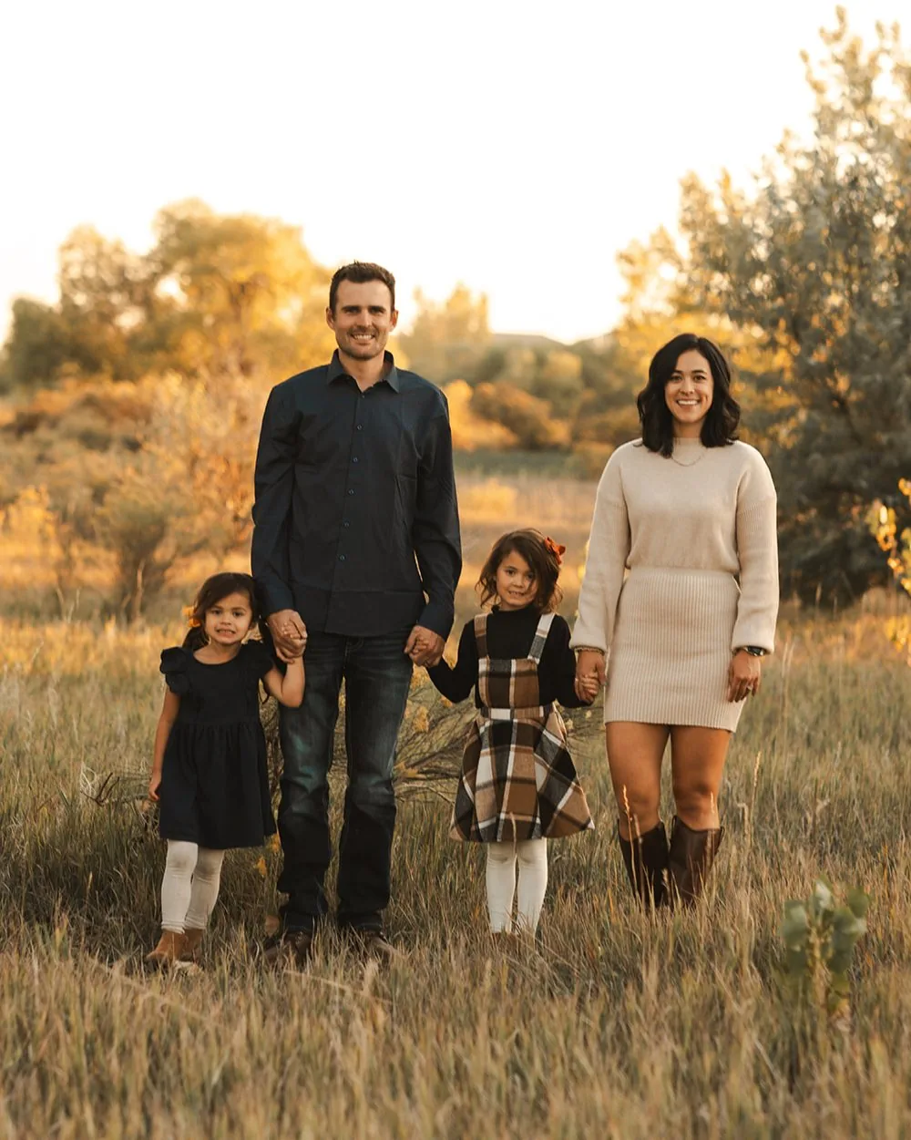 Sam and Ashleigh Rudkin with their daughters in a Northern Colorado field