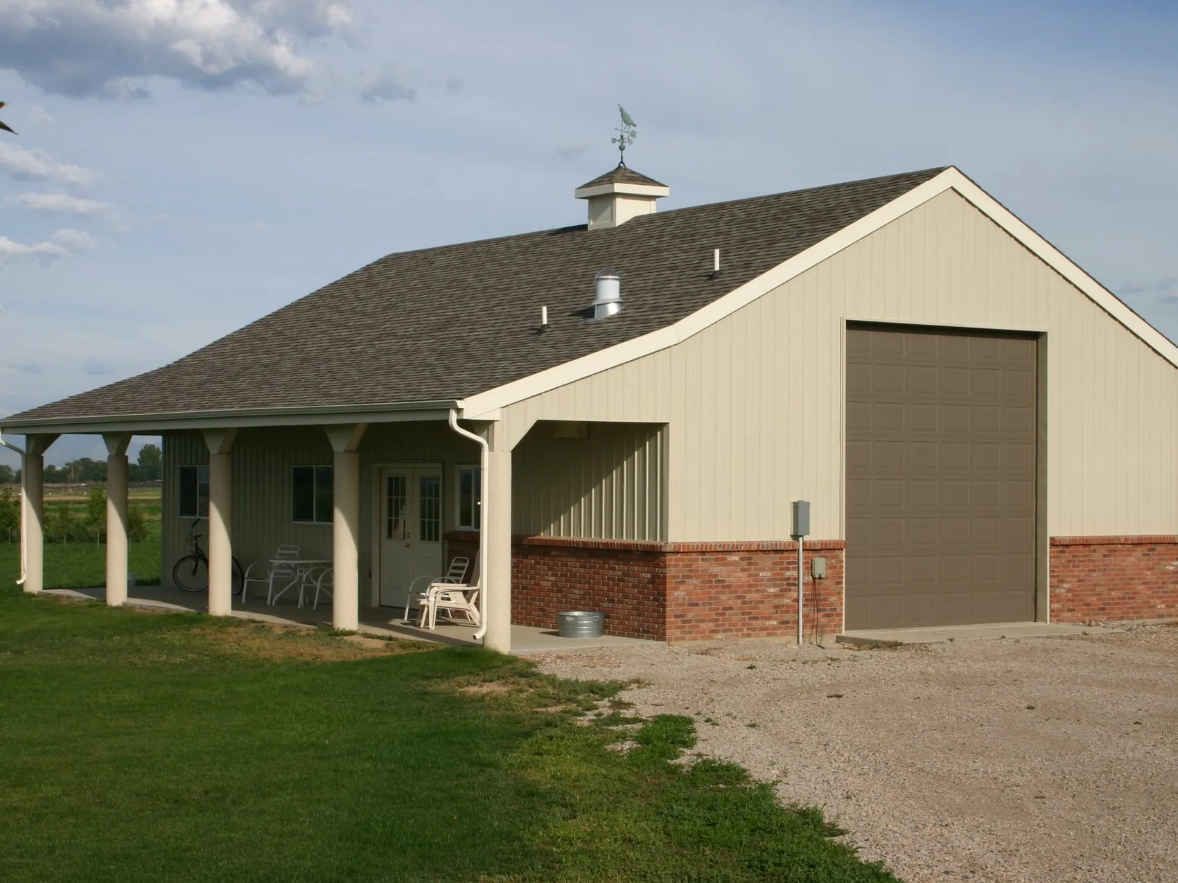 A finished barn with covered porch built by Rudkin on Northern Colorado acreage