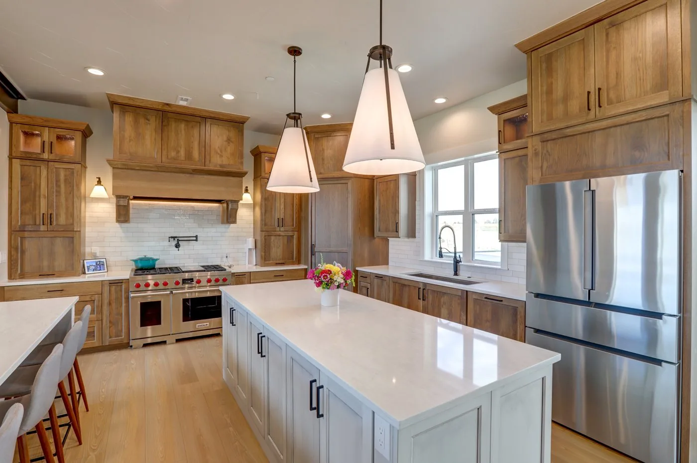 Kitchen with a long island and pendant lighting in a Rudkin build